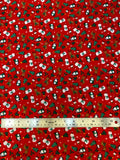Flat swatch winter themed flannel in Christmas buddies (tiny snowmen, rudolph, penguins and trees on red)