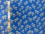 Flat swatch winter themed flannel in Winter fox (grey cartoon foxes with hats on medium blue)