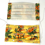 Front and back view of mask with white elastic ear loops (yellow and orange sunset look mask with mini island toss with orange floral)