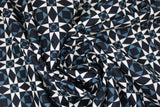 Swirled swatch American themed printed fabric in Blue & White, Diamonds & Triangles