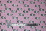 Flat swatch little zebra fabric (baby pink fabric with tossed small blue and medium pink polka dots, cartoon smiling zebra repeated allover)