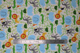 Flat swatch zoo fabric (white fabric with busy zoo style design tossed cartoon animals and green leaves allover. Full colour turtles, aligators, lions, zebras, parrots, toucans, elephants, etc.)