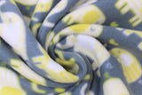 Swirled swatch yellow elephants fabric (dark pale blue fabric with white and yellow cartoon rounded look elephants in various sizes trunks faced to each other with tossed yellow hearts)