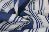 Swirled swatch aruba stripe fabric (white fabric with thick blue stripes and groups of small blue stripes within the white spaces)