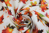 Swirled swatch Tossed Leaves fabric (off white fabric with tossed multi coloured leaves in orange, yellow, red, green, brown mixes with sparkly gold metallic accents)