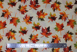 Flat swatch Tossed Leaves fabric (off white fabric with tossed multi coloured leaves in orange, yellow, red, green, brown mixes with sparkly gold metallic accents)