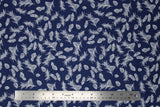Flat swatch winter printed fabric in Pinecones on Navy