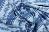Swirled swatch winter printed fabric in Pinecone Stripes on Light Blue
