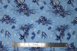 Flat swatch winter printed fabric in Swallows & Pinecones on Light Blue