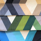 3 colourways of the Aztec printed upholstery fabric - tan/grey/black, green/grey, blue/black