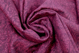 Swirled swatch paisley printed fabric in maroon