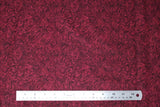 Flat swatch paisley printed fabric in maroon