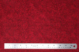 Flat swatch paisley printed fabric in dark red
