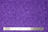 Flat swatch paisley printed fabric in purple