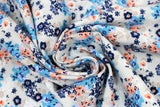 Swirled swatch Blue & Peach fabric (white fabric with tossed clustered floral in blue, navy and peach shades)