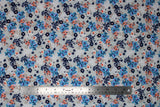 Flat swatch Blue & Peach fabric (white fabric with tossed clustered floral in blue, navy and peach shades)