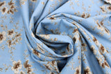 Swirled swatch Blueberry Buckle (and floral) themed fabric in Brown Flowers on Blue