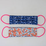 Front and back view of mask with pink elastic ear loops (dark blue mask with white and light blue daisy look floral allover)