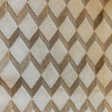 Swatch of Brent upholstery fabric - velvet texture in a geometric diamond print - in colourway Tan (ivory base with gold zigzag)