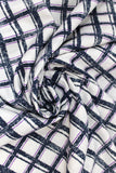 Swirled swatch calico fabric in navy, purple, white plaid