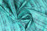 Swirled swatch calico fabric in teal & black blended