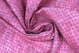 Swirled swatch calico fabric in burgundy dots on burgundy