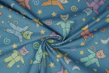Print "Blue" from the Cat's Pajamas collection, twisted to show drape and texture.
