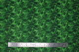 Flat swatch Pinecones fabric (green fabric with busy dark green pinecones and sprigs allover busy collage style with sparkly silver metallic effect)