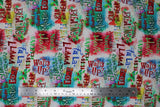 Flat swatch Mistle-Toad fabric (white and rainbow splotched fabric with multi directional and multicoloured text allover related to christmas and frogs "Mistle Toad" "Neck the Halls")
