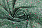 Swirled swatch Swirls fabric (dark green fabric with busy tossed tiny green leaves and red holly berries, and tossed white swirls allover)