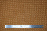 Flat swatch white cross marks fabric (dark mustard coloured fabric with tiny white crosses/x's allover)