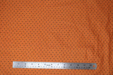Flat swatch black & orange dots fabric (medium orange fabric with small black polka dots)