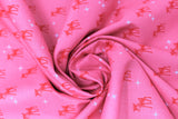 Swirled swatch Rudolph fabric (bubblegum pink fabric with small repeated red Rudolph graphics and tossed white stars)
