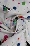Swirled swatch colourful print in white (bees and multi-coloured hexagons)