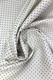 Swirled swatch assorted swiss & dots printed fabric in Small Green Dots on Off White