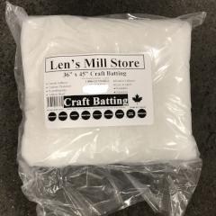 Small thick roll of white craft/quilt batting out of packaging on a white background