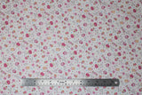 Flat swatch cupcakes fabric (white fabric with tossed blue, yellow, light and dark pink polka dots, tossed cartoon cupcakes, candies, and lollipops in pink shades, "oh so sweet" tiny cursive writing, etc.)