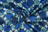 Print "Curled Up Lemurs" from the Madagascar Adventure collection, twisted to show drape and texture.