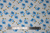 Flat swatch Dino Roarrr fabric (white fabric with tossed blue cartoon style dinosaurs with "ROARRR" text in black, yellow and blue)