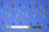 Flat swatch assorted blue fabric (blue fabric with tossed small assorted cartoon dogs and tiny bones in yellow, blue, pink colourway with brown weiner dogs)