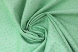 Swirled swatch Keep on Truck'n fabric (bright green fabric with medium pale green water droplet look dots allover)