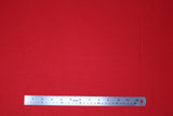 Flat swatch so ruby fabric (bright cherry red fabric with tiny faint red dots allover)