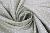 Swirled swatch Matcha Dots fabric (pale green fabric with small white polka dots allover)
