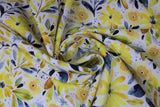 Swirled swatch fabric in white (white fabric with busy floral toss design in yellow and grey colourway - tossed floral heads and leaves)