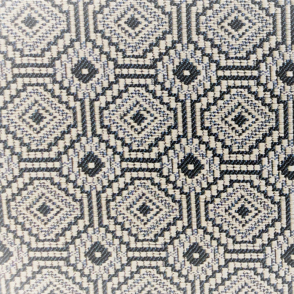 Jacquard upholstery fabric arranged in a geometric pattern - tiled concentric octagons and concentric squares in navy, cream and light blue