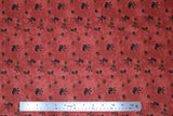 Flat swatch coffee themed fabric in Coffee Beans on Red