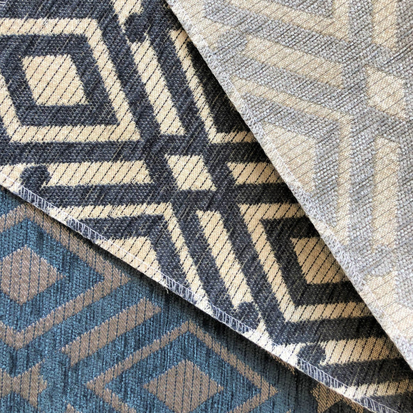 Multiple colourways of this geometric upholstery jacquard fanned out