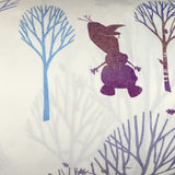 Swatch of "Silhouettes" frozen character silhouettes in purple/blue with like coloured trees on white