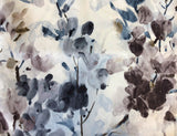 Slightly velvety white upholstery fabric printed with watercolour style abstract floral designs in the colourway Greys/Blue (navy, dark brown, taupe)