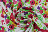 Swirled swatch beautiful bouquet fabric (white fabric with small brightly coloured floral bouquet clusters tossed allover in red/pink, purple, prange yellow floral and bright green leaves and greenery)